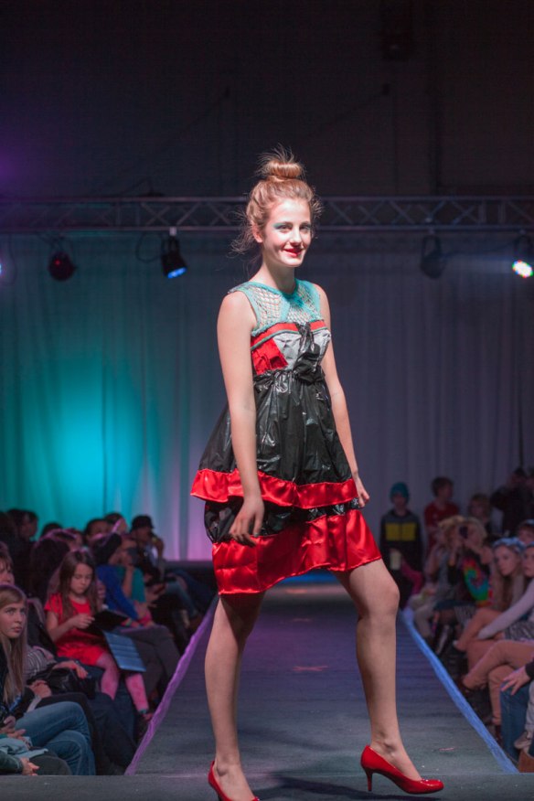 Designer: Soleil Haskell Materials: Egg cartons to form the bust, black bags for the torso and skirt, red ribbon trim, and green netting. Quote: "Inspiration can be found in almost anything, and once you find it anything can become something beautiful"  