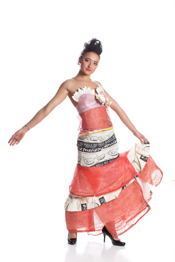 Barrio Paella Princess Designer: Alisha Simonson Model: Paris Durham Materials: paella rice & onion bags, old menus, cans, wine bottles and other material from the bar! Materials: 